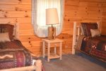 Log beds in this Blue Ridge area cabin rental